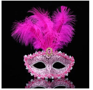 Detail of pink masquerade mask with lace, rhinestones and soft feathers on black background
