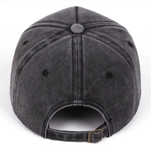 Detail of adjustable metal buckle and washed denim texture on vintage baseball cap