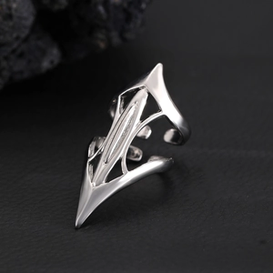 Macro view of silver gothic punk claw ring with geometric lines on black leather