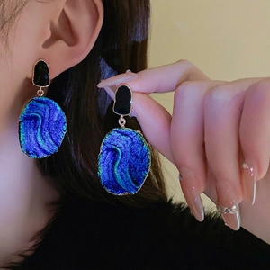 Vintage irregular earrings with blue iridescent main stone and gold plated edges