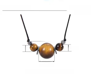 Detailed view of 16mm tiger eye pendant necklace with measurement labels and black cord