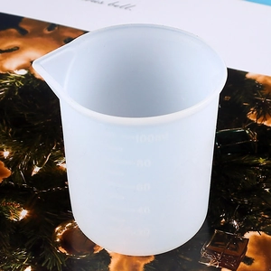 Macro detail of 100ml silicone measuring cup with clear scale for DIY resin casting