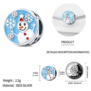Macro view of blue enamel snowman charm in S925 silver with snowflake and rhinestone details