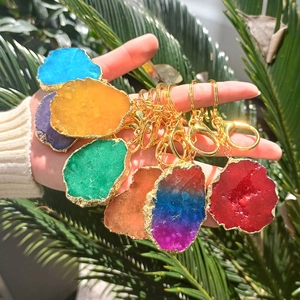 Natural agate slice keychains in multiple colors with golden metal hooks and rings