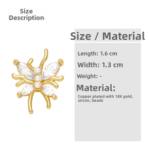 Detailed view of golden butterfly earrings with dimensions 1.6cm by 1.3cm in macro shot