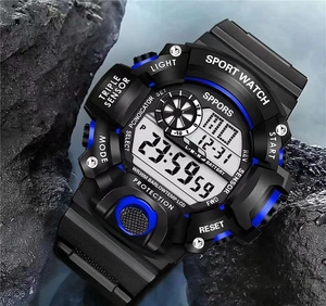 Detail of waterproof tactical sports watch with blue accents on dark volcanic rock