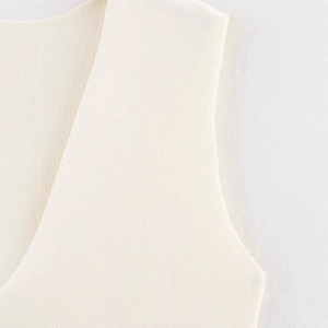 Women's minimalist knit button vest in creamy white with high-density fabric texture