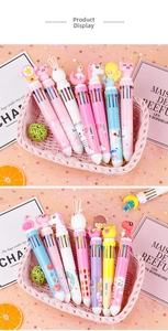 Close-up of 10-color shuttle pens with cute cartoon toppers like unicorns and bunnies