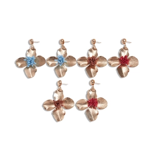 Set of vintage gold floral stud earrings with colorful bead centers in a grid layout