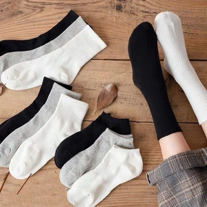 Classic cotton crew and ankle socks in black grey white shown on wood texture