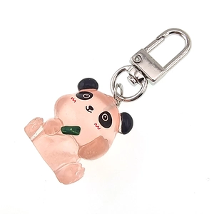 Close-up of a pink resin cartoon panda keychain with green bamboo and metal clasp