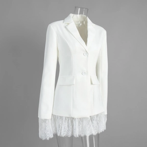 Detailed view of the white blazer showing the floral lace trim and flap pocket accents