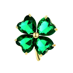 Elegant gold four-leaf clover brooch with green heart-shaped crystals on white background