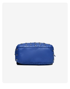 Detailed bottom view of dark blue leather backpack featuring silver metal conical studs