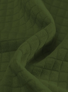 Detailed close-up of dark moss green knit fabric with textured square quilting pattern