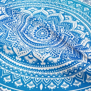 Detailed view of the fine texture and blue mandala floral pattern on a bohemian tapestry