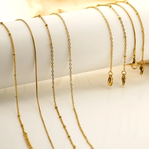 Selection of golden 18K titanium steel chains including snake and cross link styles