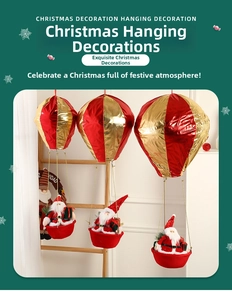Detailed view of three red and gold Santa Claus hot air balloon hanging decorations