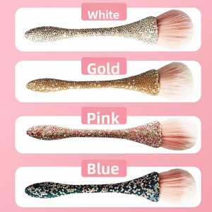 Detailed comparison of four rhinestone makeup brushes in gold, silver, pink, and blue colors