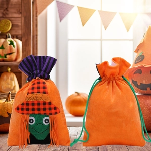Halloween witch drawstring gift bags in orange fabric for festive party decorations