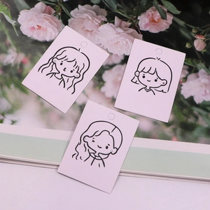 Detail of minimalist earring display cards featuring cute black line art girl illustrations