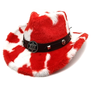 Close-up of fluffy cow print cowboy hat with studded brown leather band and star emblem