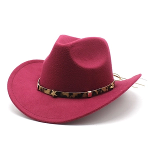 Detail of rose red felt cowboy hat featuring leopard print band and gold star studs