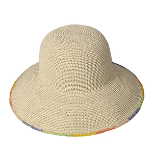 Handwoven straw sun hat with large brim and colorful stitched edges for women