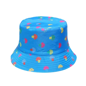 Detail of blue sun hat showing colorful cartoon mushroom prints on durable fabric