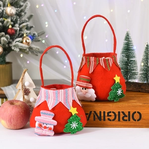 Close-up of red felt Christmas gift baskets with festive snowman and Santa decorations