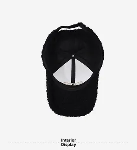 Interior view of black teddy fleece baseball cap with metal buckle and sweatband details