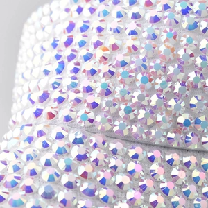 Macro shot of shimmering AB rhinestones on the fabric of an open top sun visor hat