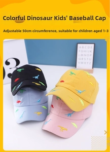 Detail of colorful dinosaur embroidery on cotton baseball caps in four vibrant colors