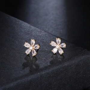 Elegant gold flower stud earrings with sparkling crystal petals for a luxury look