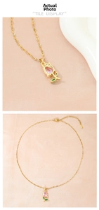 Detailed close-up and flat lay of pink crystal tulip flower pendant necklace