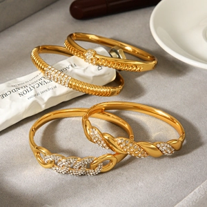 Luxurious 18k gold plated stainless steel four-piece bracelet set with sparkling zircons