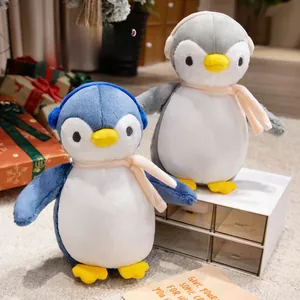 Close-up of adorable plush penguins with pink scarves in a cozy home setting