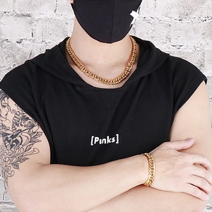 Men's bold gold-tone cuban link chain necklace and bracelet set worn by a model