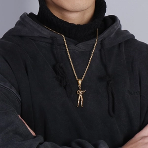 Golden hip hop soldier pendant with twist chain shown on a black hoodie for men