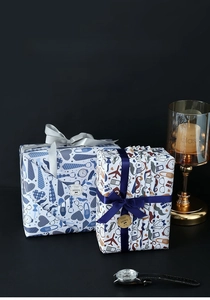 Close-up of Father's Day wrapping paper with necktie patterns and decorative stickers