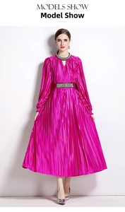 Detail of beaded neckline and pleated magenta dress with elegant waist embellishments