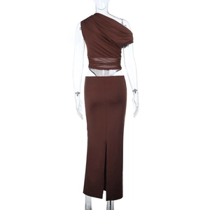 Detail view of the back of a slim fit brown dress with ruching and high slit