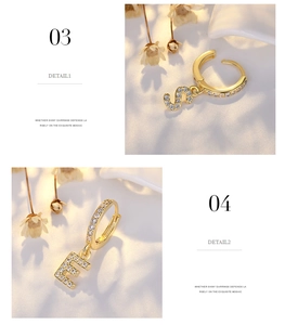 Detail view of gold letter S and E earrings with pavé set micro-inlaid zircon stones