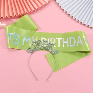 Detail of lime green satin sash with It's My Birthday print and rhinestone headband