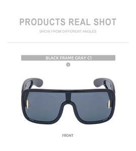 Front view of stylish oversized cycling sunglasses with black frame and gray lenses