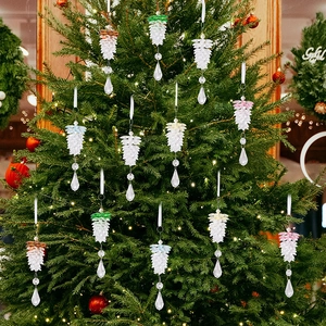 Close-up of clear acrylic pinecone ornaments with colorful crystal drops on Christmas tree
