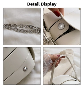 Detail view of white PU leather bag showing silver chain strap and metal magnetic buckle