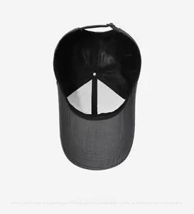 Detail of dark grey baseball cap featuring breathable mesh lining and adjustable strap