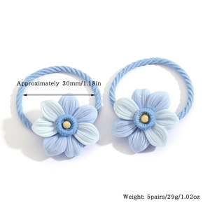 Detail of blue flower hair ties showing size dimensions and weight specifications