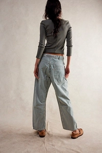 Back view of high-waisted wide-leg striped trousers with drawstring and pocket detail